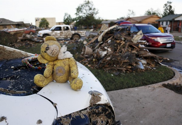 A teddy bear salvaged from the rubble of a tornado-destroyed home sits on the boot of a vehicle, in Moore, Okla., on Tuesday. Rescuers went building to building in search of victims and thousands of survivors were homeless after a massive tornado tore through the Oklahoma City suburb of Moore. A teddy bear salvaged from the rubble of a tornado-destroyed home sits on the boot of a vehicle, in Moore, Okla., on Tuesday. Rescuers went building to building in search of victims and thousands of survivors were homeless after a massive tornado tore through the Oklahoma City suburb of Moore.