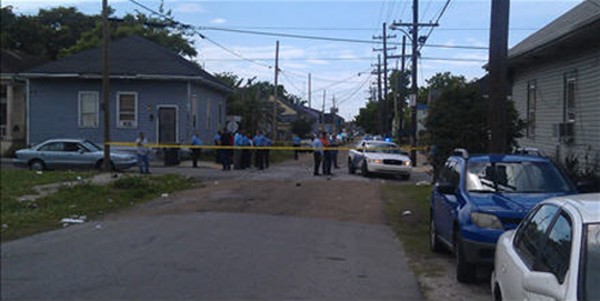 New Orleans Police Department members are seen at the site where at least 12 people were shot during a Mother's Day parade in New Orleans, La., on Sunday. New Orleans Police Department members are seen at the site where at least 12 people were shot during a Mother's Day parade in New Orleans, La., on Sunday.