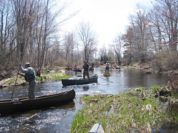 Participants in a canoe poling clinic practice their new skills. Participants in a canoe poling clinic practice their new skills.