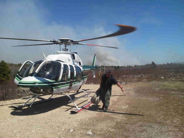 Ranger Pilot Chris Blackie deploys the Bambi Bucket to begin work on a wildfire reported in Township 18 MD in Washington County. Ranger Pilot Chris Blackie deploys the Bambi Bucket to begin work on a wildfire reported in Township 18 MD in Washington County.
