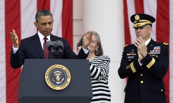 U.S. President Barack Obama directs people to be seated before his remarks as a part of Memorial Day observances at Arlington National Cemetery. U.S. President Barack Obama directs people to be seated before his remarks as a part of Memorial Day observances at Arlington National Cemetery.