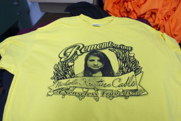 WorkStore, a screenprinting and embroidery company in Glenburn, has been making T-shirts and stickers in honor of Nichole Cable, the 15-year-old who went missing and was found dead earlier this week. Proceeds from the shirt sales will go to Nichole's family to help pay for funeral costs and other expenses. WorkStore, a screenprinting and embroidery company in Glenburn, has been making T-shirts and stickers in honor of Nichole Cable, the 15-year-old who went missing and was found dead earlier this week. Proceeds from the shirt sales will go to Nichole's family to help pay for funeral costs and other expenses.