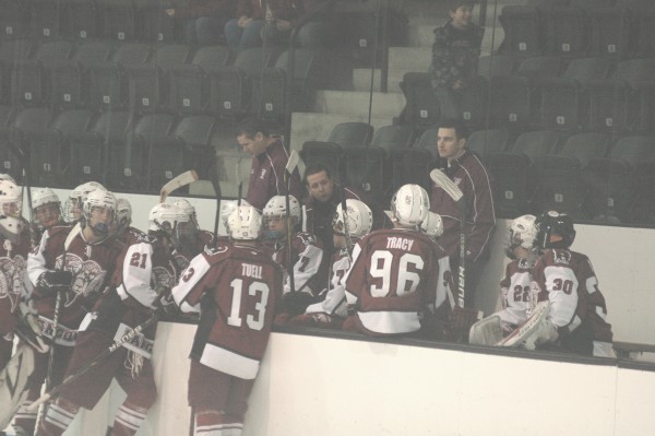 Interim Bangor High School boys hockey coach Quinn Paradis (center) talks to his team during a timeout during a game last December in Brunswick. Paradis has been named Bangor’s full-time coach. Interim Bangor High School boys hockey coach Quinn Paradis (center) talks to his team during a timeout during a game last December in Brunswick. Paradis has been named Bangor’s full-time coach.