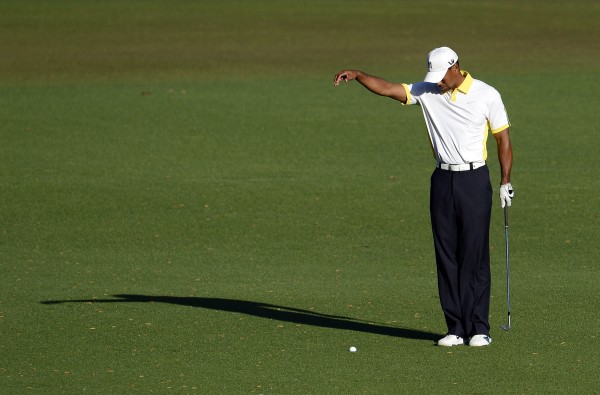 Tiger Woods takes a drop on the 15th hole during the second round of the 2013 The Masters golf tournament at Augusta National Golf Club. Tiger Woods takes a drop on the 15th hole during the second round of the 2013 The Masters golf tournament at Augusta National Golf Club.