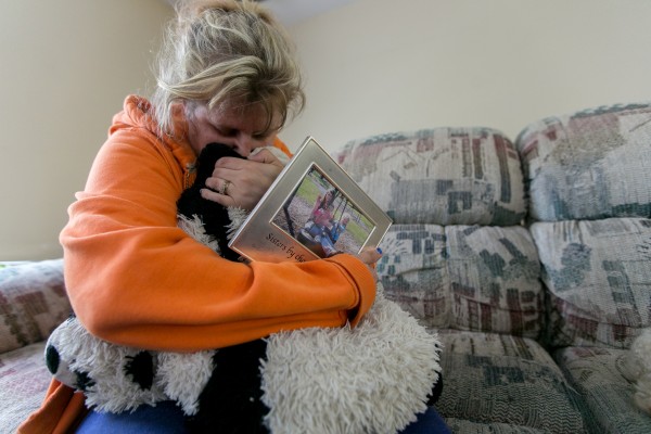 Kristine Wiley, mother of Nichole Cable, holds a picture of her daughter and hugs a pillow that belonged to Nichole at the family's Glenburn home on Tuesday. Kristine Wiley, mother of Nichole Cable, holds a picture of her daughter and hugs a pillow that belonged to Nichole at the family's Glenburn home on Tuesday.