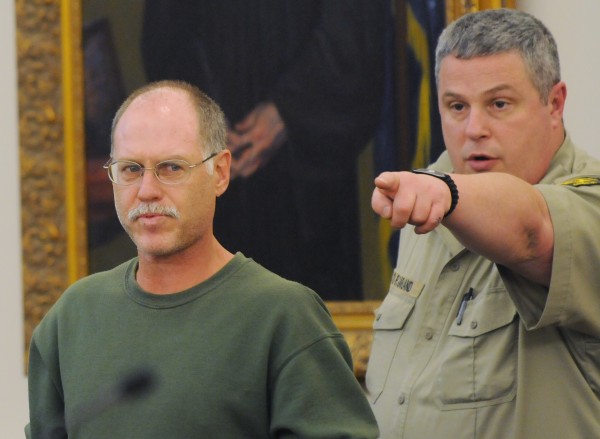 David Coon (left), of Bangor gets show, to his seat at the Penobscot Judicial center in Bangor on Tuesday by a court security officer. Coon was making his initial appearance on a murder charge in connection with the weekend death of Sherry Clifford. David Coon (left), of Bangor gets show, to his seat at the Penobscot Judicial center in Bangor on Tuesday by a court security officer. Coon was making his initial appearance on a murder charge in connection with the weekend death of Sherry Clifford.