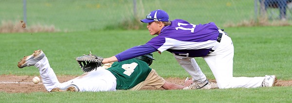Hampden's Sam Ward stretches out to try and nab a pick-off gone awry as Ben Bowie makes it back to first safely in Paris on Friday. Due to the error, Bowie was able to make it to third base before being stopped. The Vikings won 4-1. Hampden's Sam Ward stretches out to try and nab a pick-off gone awry as Ben Bowie makes it back to first safely in Paris on Friday. Due to the error, Bowie was able to make it to third base before being stopped. The Vikings won 4-1.