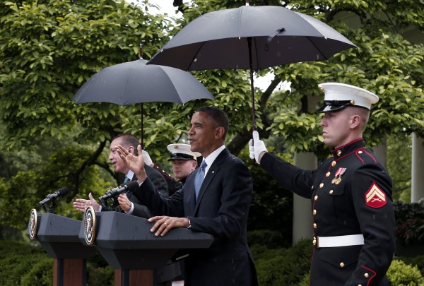 U.S. Marines hold umbrellas as rain falls during a joint news conference between President Barack Obama and Turkish Prime Minister Recep Tayyip Erdogan in the White House Rose Garden in Washington, May 16, 2013. U.S. Marines hold umbrellas as rain falls during a joint news conference between President Barack Obama and Turkish Prime Minister Recep Tayyip Erdogan in the White House Rose Garden in Washington, May 16, 2013.