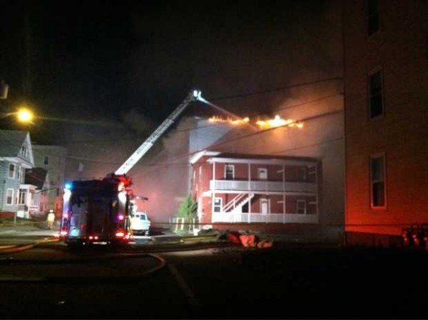 Firefighters battle a blaze on Pierce Street in Lewiston on Friday night. Firefighters battle a blaze on Pierce Street in Lewiston on Friday night.