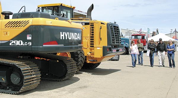 Visitors to the Northeastern Forest Products Expo walk past large logging equipment manufactured by Hyundai. The expo will be held May 17-18 at Bass Park in Bangor. Visitors to the Northeastern Forest Products Expo walk past large logging equipment manufactured by Hyundai. The expo will be held May 17-18 at Bass Park in Bangor.