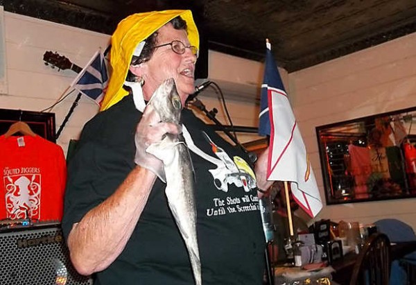 Daphne Izer holds a fish about to be kissed during the Screeching In ceremony at last year's Newfoundland Day. The Screeching In, which involves kissing the fish, eating bologna and drinking a shot of rum, makes one an honorary Newfoundlander. This year's event is being held June 1 at the Poland Spring Resort. Daphne Izer holds a fish about to be kissed during the Screeching In ceremony at last year's Newfoundland Day. The Screeching In, which involves kissing the fish, eating bologna and drinking a shot of rum, makes one an honorary Newfoundlander. This year's event is being held June 1 at the Poland Spring Resort.