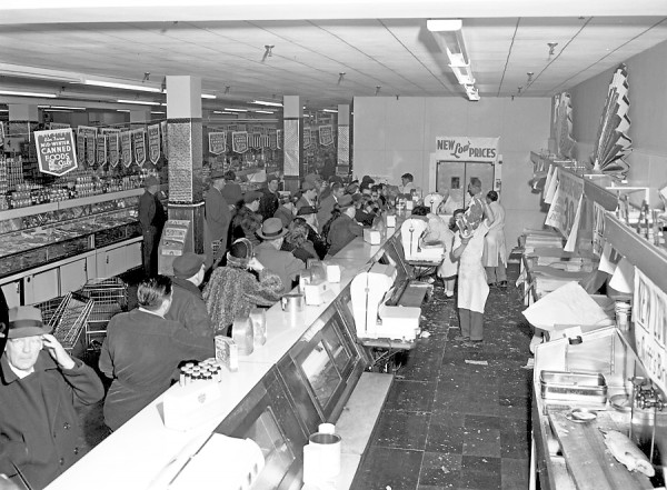 The meat counter at the Columbia Market in Bangor bore more than a slight resemblance to old Mother Hubbard's calorie-barren shelves on Thursday, Feb. 19, 1953 after bargain-hungry residents battled to purchase 12,000 pounds of beef in five hours at prices ranging from nine to 39 cents per pound. According to Albert H. Smaha, manager, the picture above shows the crowd at an ebb. Early arrivals forced the store to open 45 minutes early, he said, and the meat was gone by 1 o'clock in the afternoon. Some people bought as much as 100 pounds after sampling the meat at our counter, Smaha said. The meat counter at the Columbia Market in Bangor bore more than a slight resemblance to old Mother Hubbard's calorie-barren shelves on Thursday, Feb. 19, 1953 after bargain-hungry residents battled to purchase 12,000 pounds of beef in five hours at prices ranging from nine to 39 cents per pound. According to Albert H. Smaha, manager, the picture above shows the crowd at an ebb. Early arrivals forced the store to open 45 minutes early, he said, and the meat was gone by 1 o'clock in the afternoon. Some people bought as much as 100 pounds after sampling the meat at our counter, Smaha said.