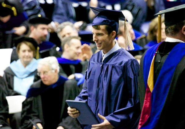Tyler Mason Walsh, son of Shawn Walsh, a former UMaine Hockey Coach legend, receives his diploma at the 2013 University of Maine, Orono graduation ceremony at Alfond Arena Saturday, May 11 2013. Tyler Mason Walsh, son of Shawn Walsh, a former UMaine Hockey Coach legend, receives his diploma at the 2013 University of Maine, Orono graduation ceremony at Alfond Arena Saturday, May 11 2013.
