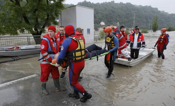 A rescue team evacuates a man on the stretcher in the flooded district of the Bavarian town of Passau, about 124 miles north-east of Munich on Tuesday. Torrential rain in the south and south-east of Germany caused heavy flooding over the weekend, forcing people to evacuate their homes. A rescue team evacuates a man on the stretcher in the flooded district of the Bavarian town of Passau, about 124 miles north-east of Munich on Tuesday. Torrential rain in the south and south-east of Germany caused heavy flooding over the weekend, forcing people to evacuate their homes.