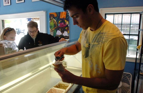 Ben Cline (right) scoops "Dude" -flavored ice cream for Jeff Myer while Myer's wife, Sarah, waits for Nutella at the Mount Desert Island Ice Cream Co.'s shop on Firefly Lane in Bar Harbor on July 3, 2009. Ben Cline (right) scoops "Dude" -flavored ice cream for Jeff Myer while Myer's wife, Sarah, waits for Nutella at the Mount Desert Island Ice Cream Co.'s shop on Firefly Lane in Bar Harbor on July 3, 2009.