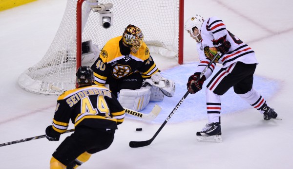 Boston Bruins defenseman Dennis Seidenberg (44) watches as goalie Tuukka Rask (40) makes a save against Chicago Blackhawks center Andrew Shaw during the third period in Game 3 of the Stanley Cup Finals at TD Garden in Boston Monday night. Boston Bruins defenseman Dennis Seidenberg (44) watches as goalie Tuukka Rask (40) makes a save against Chicago Blackhawks center Andrew Shaw during the third period in Game 3 of the Stanley Cup Finals at TD Garden in Boston Monday night.