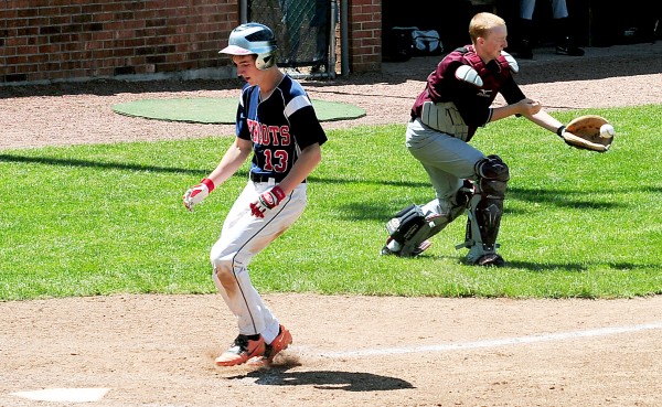 Bangor Christian's Seth Pearson easily makes it home as Buckfield's Jared Eastman catches a throw from the outfield during the Class D State Championship Saturday in Standish. Bangor Christian's Seth Pearson easily makes it home as Buckfield's Jared Eastman catches a throw from the outfield during the Class D State Championship Saturday in Standish.