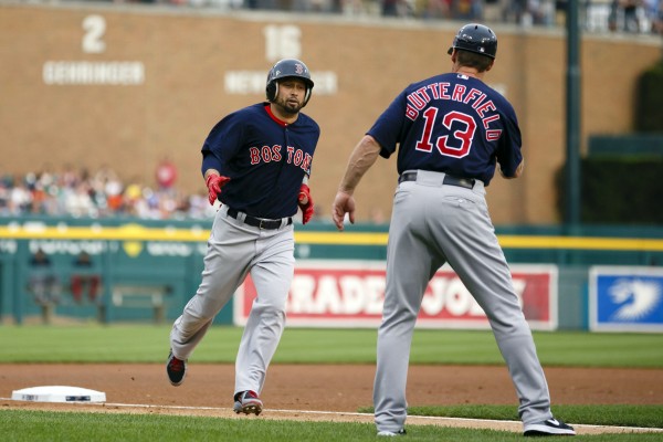 Boston's Shane Victorino receives congratulations from third base coach Brian Butterfield after he hit a home run in the first inning against the Detroit Tigers at Comerica Park in Detroit Friday night. Boston's Shane Victorino receives congratulations from third base coach Brian Butterfield after he hit a home run in the first inning against the Detroit Tigers at Comerica Park in Detroit Friday night.