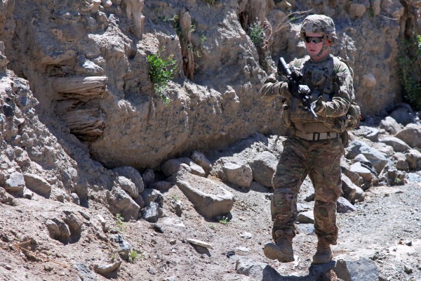 U.S. Army Sgt. Corey Garver, of Topsham, walks around a village in Paktia province, Afghanistan, on May 29, 2013, in this photo taken by Army photographer Spc. Robert Porter, which was posted on the Department of Defense website as part of a slideshow earlier this month. Garver died on June 23, 2013 from an improvised explosive device in Afghanistan while assigned to the 101st Airborne Division's Company B, 1st Battalion, 506th Infantry Regiment, 4th Brigade Combat Team. U.S. Army Sgt. Corey Garver, of Topsham, walks around a village in Paktia province, Afghanistan, on May 29, 2013, in this photo taken by Army photographer Spc. Robert Porter, which was posted on the Department of Defense website as part of a slideshow earlier this month. Garver died on June 23, 2013 from an improvised explosive device in Afghanistan while assigned to the 101st Airborne Division's Company B, 1st Battalion, 506th Infantry Regiment, 4th Brigade Combat Team.