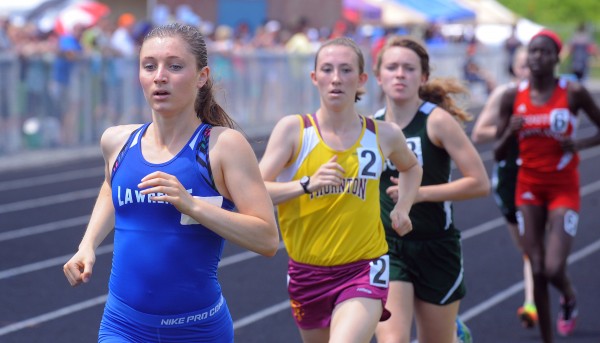 Erzsebet Nagy (left) of Lawrence High School won the girls 1600 meter run with the time of 5 minutes, 01.07 seconds during the Class A State Championship Track and Field meet Saturday at the Brewer Community School. Erzsebet Nagy (left) of Lawrence High School won the girls 1600 meter run with the time of 5 minutes, 01.07 seconds during the Class A State Championship Track and Field meet Saturday at the Brewer Community School.