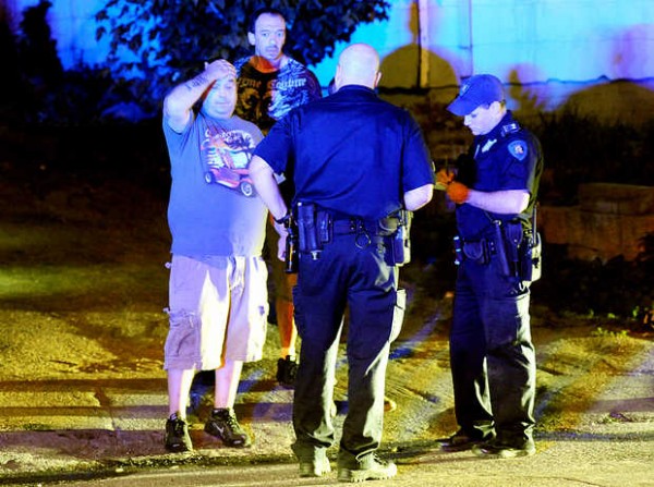 Lewiston police officers talk with witnesses about the brawl on Bartlett Street in downtown Lewiston on Thursday. Lewiston police officers talk with witnesses about the brawl on Bartlett Street in downtown Lewiston on Thursday.