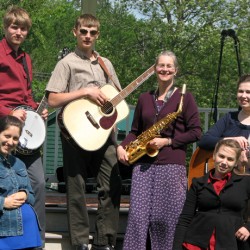 The Zevulon band members now range in age from 16 to a mom/grandmother. Esther (vocals), Clarissa (guitar), Robert (banjo) and Joshua (mandolin) were all part of the Abbott Hill Ramblers bluegrass program. Grace (piano) has performed both solo and with various ensembles before joining Zevulon in 2010.
Mom/Grandmother Deb (bass) grew up playing jazz and blues on alto saxophone, and is active in the Foxcroft Academy music program. Dad/Grandfather Todd is part of the show, too, running the sound board off stage.
The Zevulon band members now range in age from 16 to a mom/grandmother. Esther (vocals), Clarissa (guitar), Robert (banjo) and Joshua (mandolin) were all part of the Abbott Hill Ramblers bluegrass program. Grace (piano) has performed both solo and with various ensembles before joining Zevulon in 2010.
Mom/Grandmother Deb (bass) grew up playing jazz and blues on alto saxophone, and is active in the Foxcroft Academy music program. Dad/Grandfather Todd is part of the show, too, running the sound board off stage.