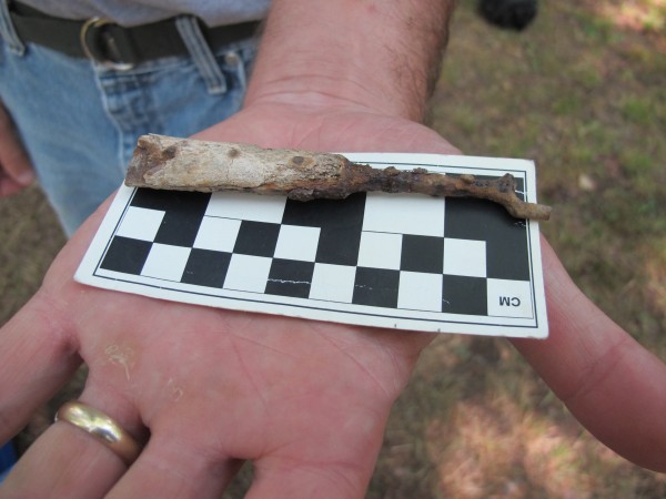 Professor Carter holds one of the artifacts found at the Joy/Flood site: a bone-handled fork. Professor Carter holds one of the artifacts found at the Joy/Flood site: a bone-handled fork.