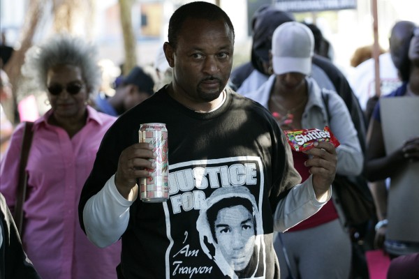 Community activist Najee Ali holds Skittles and an ice tea during a peaceful protest of the acquittal of George Zimmerman for the 2012 shooting death of Trayvon Martin, in Los Angeles, California July 15, 2013. Community activist Najee Ali holds Skittles and an ice tea during a peaceful protest of the acquittal of George Zimmerman for the 2012 shooting death of Trayvon Martin, in Los Angeles, California July 15, 2013.