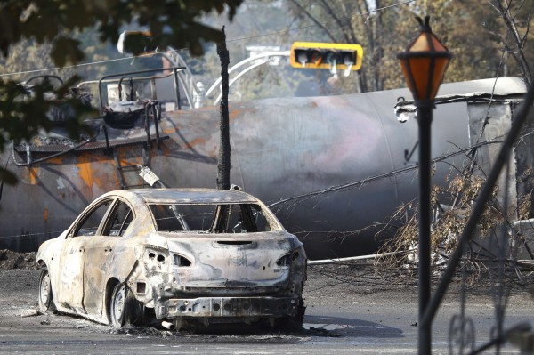 A burnt-out vehicle sits near the wreckage of a train car after a train derailment in Lac-Megantic, Quebec, on Sunday. A driverless freight train carrying tankers of petroleum products derailed at high speed and exploded into a giant fireball in the middle of the small Canadian town of Lac-Megantic early on Saturday, destroying dozens of buildings and leaving an unknown number of people feared missing. A burnt-out vehicle sits near the wreckage of a train car after a train derailment in Lac-Megantic, Quebec, on Sunday. A driverless freight train carrying tankers of petroleum products derailed at high speed and exploded into a giant fireball in the middle of the small Canadian town of Lac-Megantic early on Saturday, destroying dozens of buildings and leaving an unknown number of people feared missing.