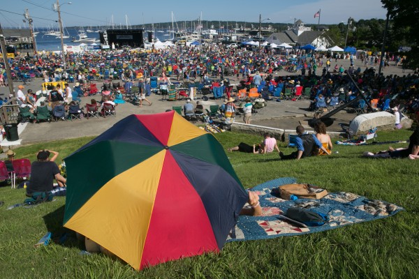 Fans guard themselves from the heat with an umbrella during the North Atlantic Blues Festival in Rockland on Saturday, July 13, 2013. This weekend marked the 20th anniversary of the festival. Fans guard themselves from the heat with an umbrella during the North Atlantic Blues Festival in Rockland on Saturday, July 13, 2013. This weekend marked the 20th anniversary of the festival.