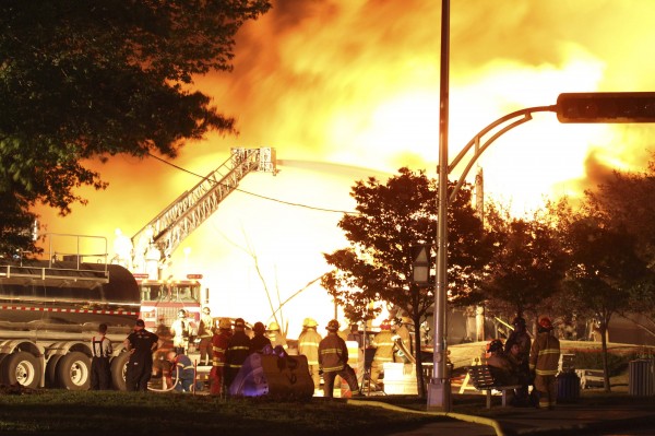First responders fight burning trains after a train derailment and explosion in Lac-Megantic, Quebec early July 6, 2013, in this picture provided by the Transportation Safety Board of Canada. The driverless, runaway fuel train that exploded in a deadly ball of flames in the center of the small Quebec town started rumbling down an empty track just minutes after a fire crew had extinguished a blaze in one of its parked locomotives, an eyewitness said on July 8, 2013. First responders fight burning trains after a train derailment and explosion in Lac-Megantic, Quebec early July 6, 2013, in this picture provided by the Transportation Safety Board of Canada. The driverless, runaway fuel train that exploded in a deadly ball of flames in the center of the small Quebec town started rumbling down an empty track just minutes after a fire crew had extinguished a blaze in one of its parked locomotives, an eyewitness said on July 8, 2013.