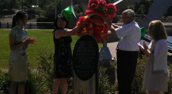 Jing Zhang, president of the Bangor Chinese School, and Bangor City Council Chairman Nelson Durgin, unveil a monument recognizing the sister-city relationship between Bangor and Harbin, China on Monday, July 15, at the Bangor Waterfront. Jing Zhang, president of the Bangor Chinese School, and Bangor City Council Chairman Nelson Durgin, unveil a monument recognizing the sister-city relationship between Bangor and Harbin, China on Monday, July 15, at the Bangor Waterfront.