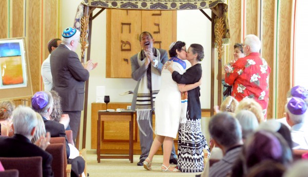 Rabbi Darah Lerner (left) and her spouse Kelly Quagliotti kiss at the end of their wedding ceremony at Congregation Beth El in Bangor on Sunday afternoon. Rabbi Darah Lerner (left) and her spouse Kelly Quagliotti kiss at the end of their wedding ceremony at Congregation Beth El in Bangor on Sunday afternoon.