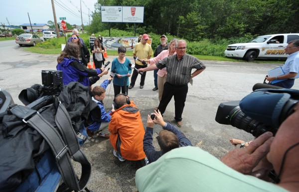 Members of the media surround activist Nancy Galland of Stockton Springs as she reads a statement about the recent oil train derailment in Lac-Megantic, Quebec, while standing at the entrance to Montreal, Maine & Atlantic Railroad in Hermon on Monday. Members of the media surround activist Nancy Galland of Stockton Springs as she reads a statement about the recent oil train derailment in Lac-Megantic, Quebec, while standing at the entrance to Montreal, Maine & Atlantic Railroad in Hermon on Monday.