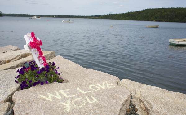 Family members of Melissa Moyer place memorials and draw chalk writings in memory of Moyer and Amy Stiner who died after apparently becoming disoriented in the fog and driving off a boat ramp on Schoppee Point Road in Roque Bluffs Tuesday night. Family members of Melissa Moyer place memorials and draw chalk writings in memory of Moyer and Amy Stiner who died after apparently becoming disoriented in the fog and driving off a boat ramp on Schoppee Point Road in Roque Bluffs Tuesday night.