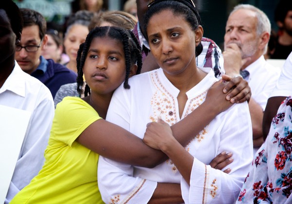Abeir Dhalac and her daughter Walla Mohamed listen to speakers in Portland's Monument Square Monday afternoon during a memorial service and rally for Trayvon Martin. Abeir Dhalac and her daughter Walla Mohamed listen to speakers in Portland's Monument Square Monday afternoon during a memorial service and rally for Trayvon Martin.
