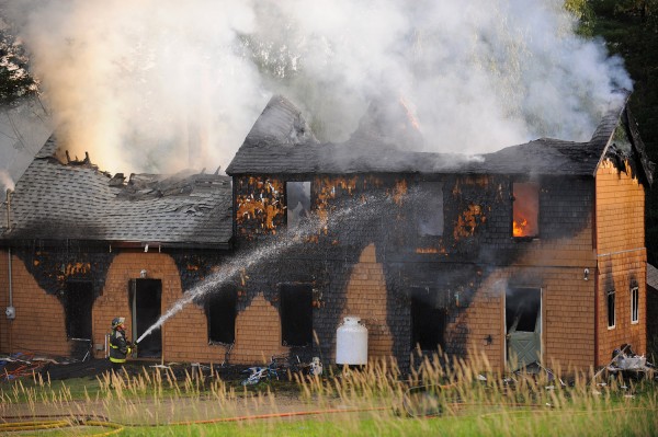 Firefighters battle a house fire on Monroe Road in Winterport on Friday evening. Crews from Winterport, Frankfort, Monroe and Newburgh fought the fire. Firefighters battle a house fire on Monroe Road in Winterport on Friday evening. Crews from Winterport, Frankfort, Monroe and Newburgh fought the fire.