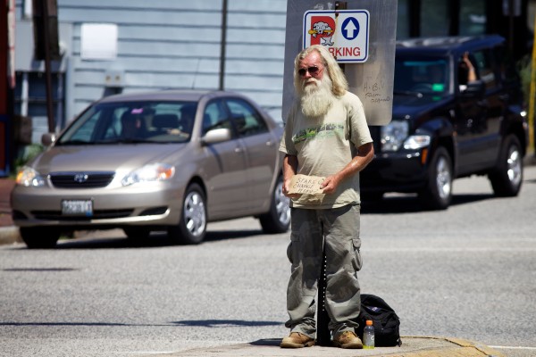 A man, who did not want to give his name, asks for spare change in the median strip at St. John Street and Congress Street in Portland Monday. City councilors took up renewed debate Monday night over banning panhandling in the median. A man, who did not want to give his name, asks for spare change in the median strip at St. John Street and Congress Street in Portland Monday. City councilors took up renewed debate Monday night over banning panhandling in the median.