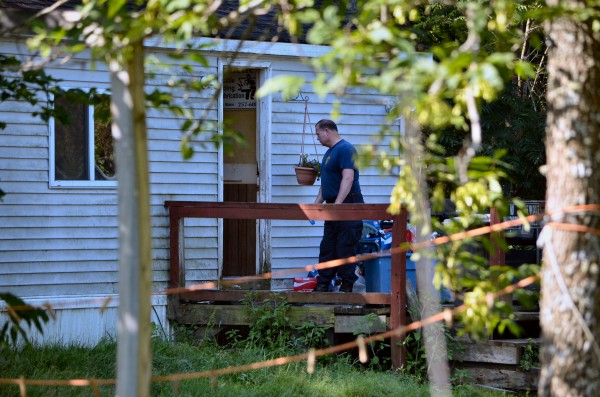 A member of the Maine State Police stands outside the door of a Main Street home in Detroit where the body of a middle-aged man was recovered Thursday morning. A member of the Maine State Police stands outside the door of a Main Street home in Detroit where the body of a middle-aged man was recovered Thursday morning.