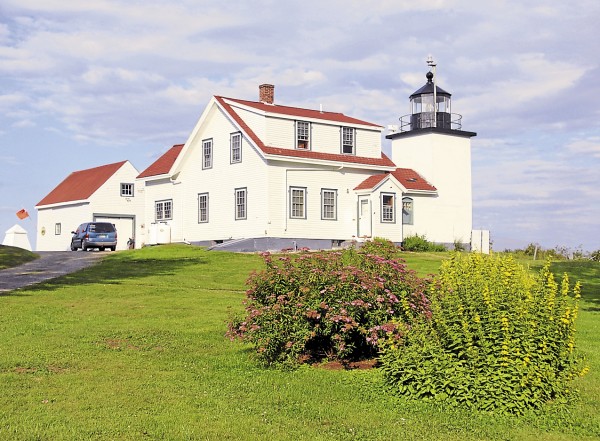 The evening sun illuminates Fort Point Lighthouse and nearby flowers in Stockton Springs on July 21. The evening sun illuminates Fort Point Lighthouse and nearby flowers in Stockton Springs on July 21.
