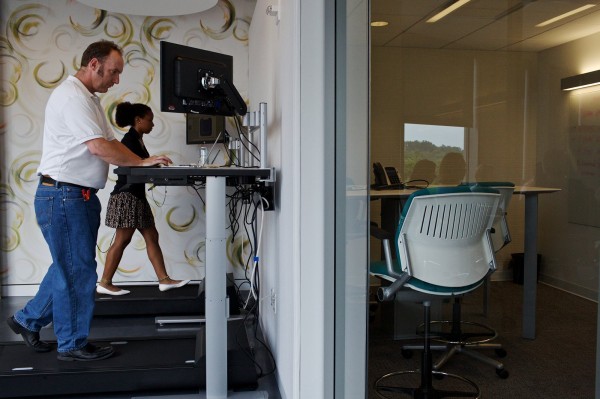 Michelle Schneider and Dave Dunn use the treadmill desks at Evolent, a health care startup company in Arlington, Va, on June 26, 2013. Michelle Schneider and Dave Dunn use the treadmill desks at Evolent, a health care startup company in Arlington, Va, on June 26, 2013.