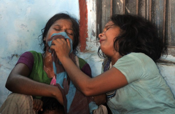 Women mourn the death of their children who died after consuming contaminated meals given to children at a school on Tuesday at Chapra in the eastern Indian state of Bihar July 17, 2013. At least 20 children died and dozens were taken to hospital with apparent food poisoning after eating a meal provided for free at their school in the district of Chapra in the eastern Indian state of Bihar, the education minister said on Wednesday, sparking violent protests. Women mourn the death of their children who died after consuming contaminated meals given to children at a school on Tuesday at Chapra in the eastern Indian state of Bihar July 17, 2013. At least 20 children died and dozens were taken to hospital with apparent food poisoning after eating a meal provided for free at their school in the district of Chapra in the eastern Indian state of Bihar, the education minister said on Wednesday, sparking violent protests.