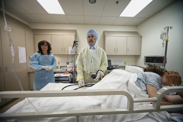 Amrit Narula, seen in this July 1, 2013 photo at Schuylkill Endoscopy in Pottsville, Pa., where he is co-owner and a physician, says that being a doctor consumes one's life. Amrit Narula, seen in this July 1, 2013 photo at Schuylkill Endoscopy in Pottsville, Pa., where he is co-owner and a physician, says that being a doctor consumes one's life.