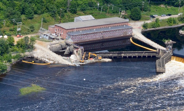 Demolition crews breach the Veazie Dam Monday in Veazie, Maine. Demolition crews breach the Veazie Dam Monday in Veazie, Maine.