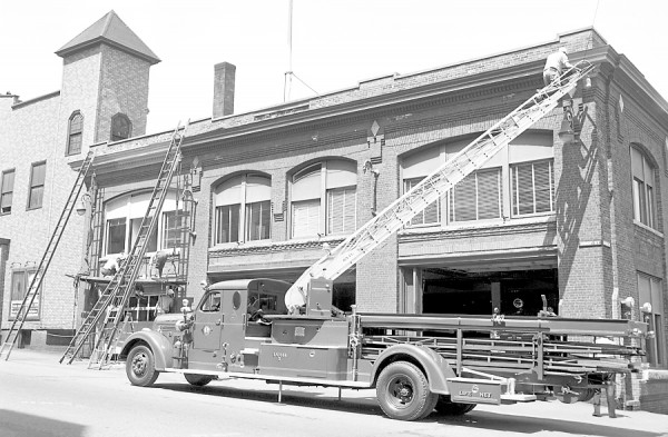 Members of the Bangor Fire Department took advantage of the good weather on Monday, May 11, 1953 to begin a repainting of Central Station on Union Street. The number two ladder truck was hauled out and put to use and most of the available manpower was armed with brushes. According to Chief John J. Nelligan, all of the structure except the bricks will be painted, and the most surprising thing of all is the fact that the boys are getting away from the traditional green which had decorated the station from its beginning. This time they're using gray, figuring it will wear better. Members of the Bangor Fire Department took advantage of the good weather on Monday, May 11, 1953 to begin a repainting of Central Station on Union Street. The number two ladder truck was hauled out and put to use and most of the available manpower was armed with brushes. According to Chief John J. Nelligan, all of the structure except the bricks will be painted, and the most surprising thing of all is the fact that the boys are getting away from the traditional green which had decorated the station from its beginning. This time they're using gray, figuring it will wear better.