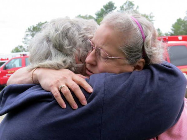 Homeowner Laura Freeman, right, is comforted by her neighbor and friend Judy Hawley, as firefighters battle flames erupted in Freeman's garage and spread to the house early Thursday evening at 8 Summerland St. in Paris. Homeowner Laura Freeman, right, is comforted by her neighbor and friend Judy Hawley, as firefighters battle flames erupted in Freeman's garage and spread to the house early Thursday evening at 8 Summerland St. in Paris.