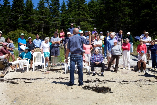 Bud Brown of Eco-Analysts Inc. talks to a crowd of people about a proposed dredging project in a cove on Southport Island Thursday. Bud Brown of Eco-Analysts Inc. talks to a crowd of people about a proposed dredging project in a cove on Southport Island Thursday.