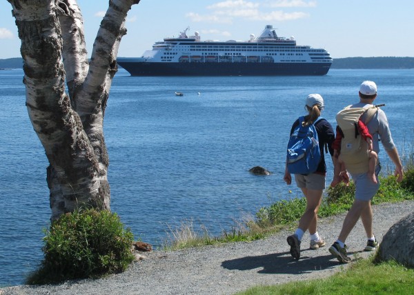 A couple carrying a small child stroll along Bar Harbor's Shore Path on Sunday, Aug. 4, 2013 while the cruise ship Maasdam sits anchored offshore in Frenchman Bay. According to information recently released by Cruise Lines International Association, direct spending in Maine by the cruise ship industry increased from $45 million in 2011 to $46 million in 2012. A couple carrying a small child stroll along Bar Harbor's Shore Path on Sunday, Aug. 4, 2013 while the cruise ship Maasdam sits anchored offshore in Frenchman Bay. According to information recently released by Cruise Lines International Association, direct spending in Maine by the cruise ship industry increased from $45 million in 2011 to $46 million in 2012.