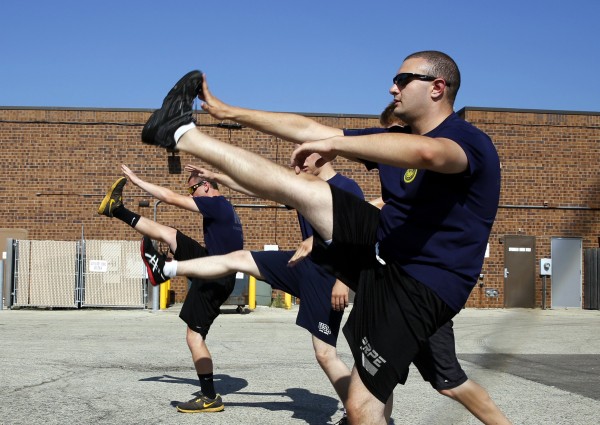Herschel Gilbert (right), 20, leads three other future sailors in their daily physical training regimen at the Armed Forces Recruiting Center on July 17, 2013, in Crystal Lake, Illinois. Gilbert weighed more than 250 pounds when he first visited a recruiter last year. Herschel Gilbert (right), 20, leads three other future sailors in their daily physical training regimen at the Armed Forces Recruiting Center on July 17, 2013, in Crystal Lake, Illinois. Gilbert weighed more than 250 pounds when he first visited a recruiter last year.