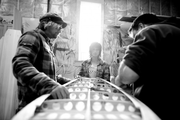 Professional surfers Mikey DeTemple (from left) and Kassia Meador learn board building techniques from Grain Surfboards owner Mike LaVecchia at the companys shop in York, Maine. Professional surfers Mikey DeTemple (from left) and Kassia Meador learn board building techniques from Grain Surfboards owner Mike LaVecchia at the companys shop in York, Maine.